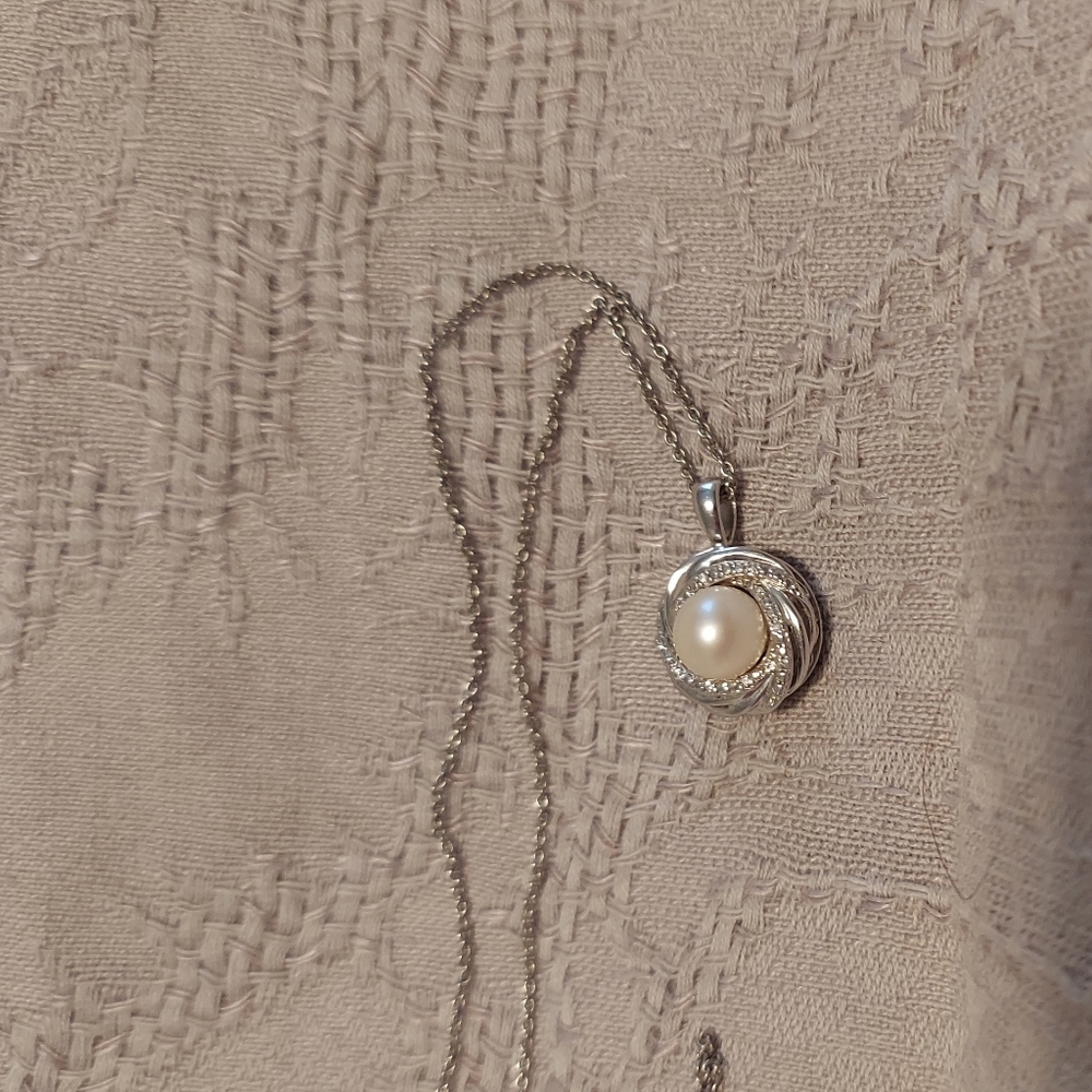 Silver, pearl, and diamond necklace